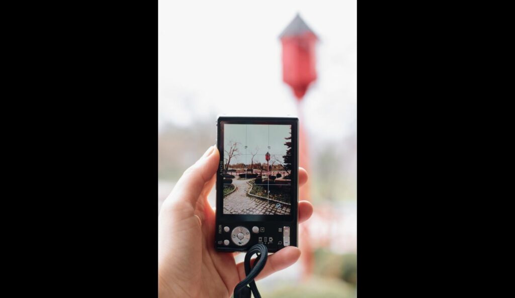 Close-up of a camera screen showing the rule of thirds grid while composing a shot